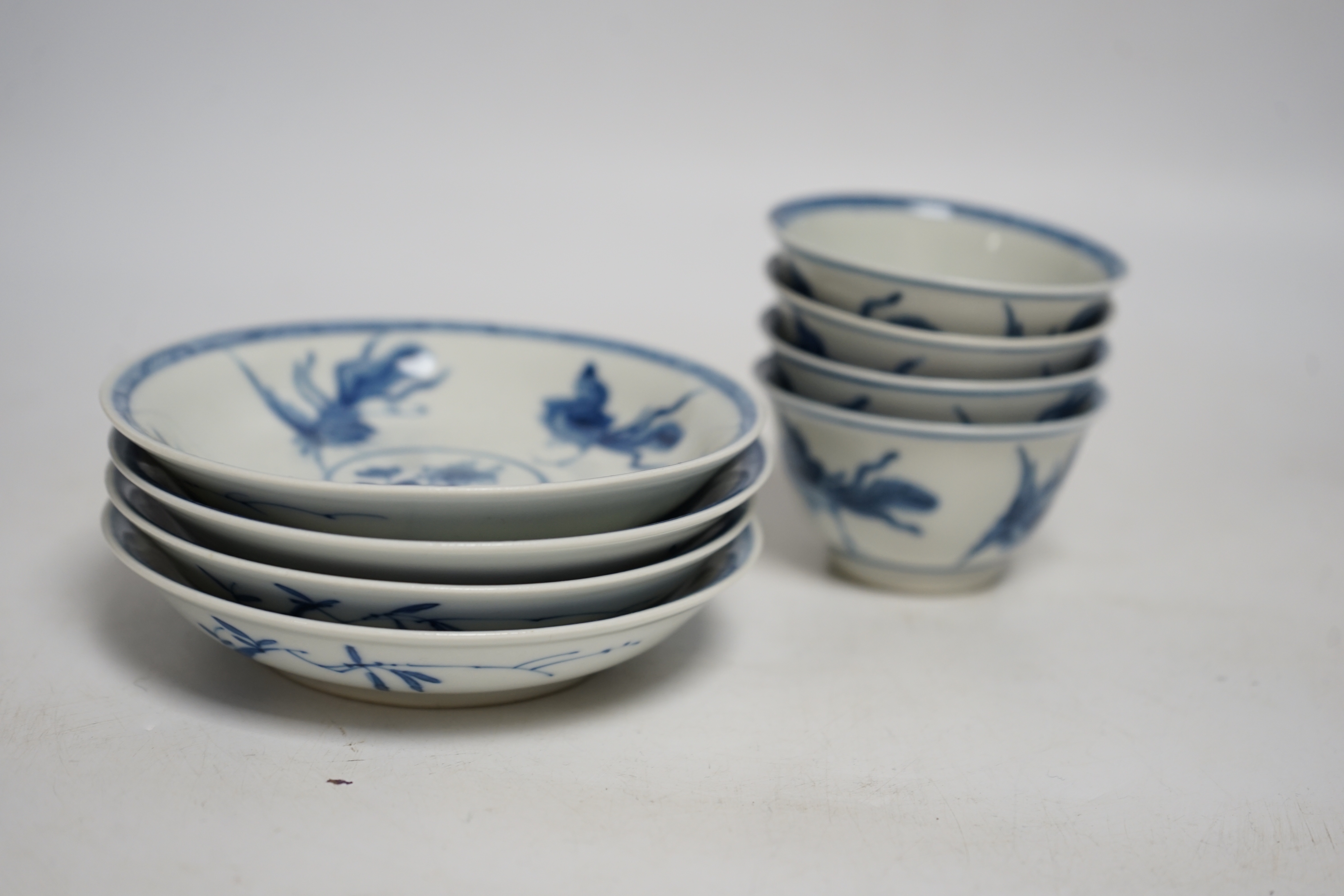 A set of four Chinese blue and white teabowls and saucers